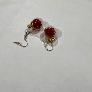 hand-made earrings by a 10 years old girl.